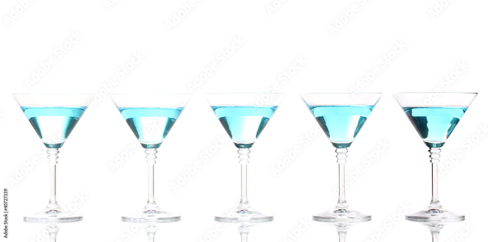 Blue cocktail in martini glasses isolated on white Blue cocktail in martini glasses isolated on white