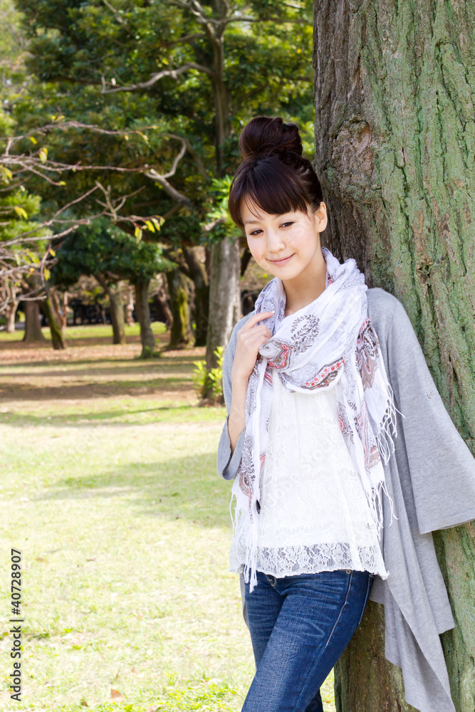 Fototapeta premium Beautiful young woman in the forest