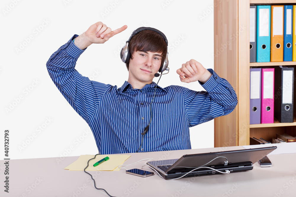 Young Businessman in office with a relaxed music Young Businessman in office with a relaxed music