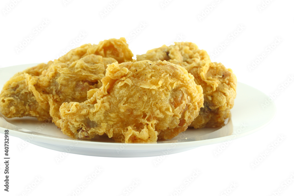 Chicken wing fried focus near dish on white background. Chicken wing fried focus near dish on white background.