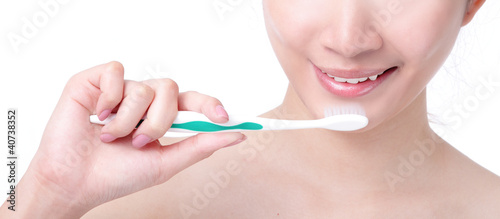 close up of woman mouth and brushing teeth