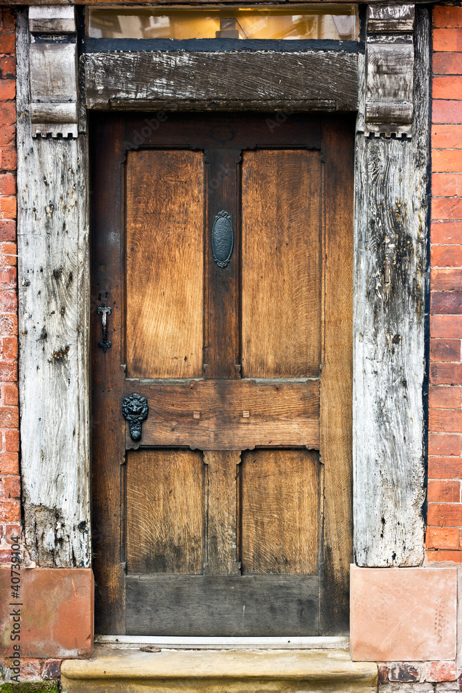 Old Oak door, frame, and window of tudor building. Old Oak door, frame, and window of tudor building.