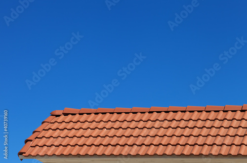 Roof tiles and blue clear sky
