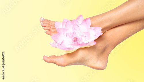 Woman feet with flower.