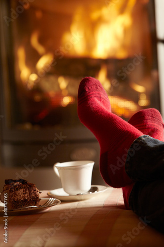 Photography Close Up Of Mans Feet Relaxing By Cosy Log Fire With Tea And Cak
