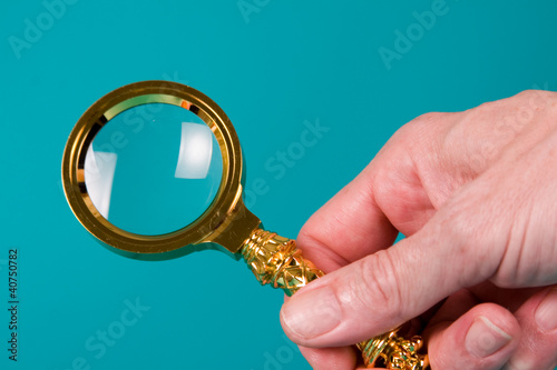 Magnifying glass in hand