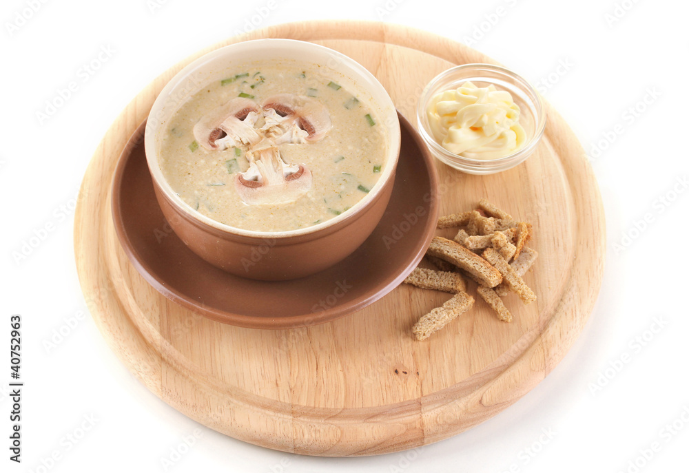 Tasty soup on wooden round board isolated on white Tasty soup on wooden round board isolated on white