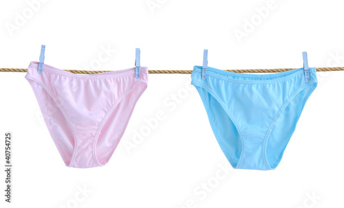 Pink and light blue women s panties  dry on a clothesline