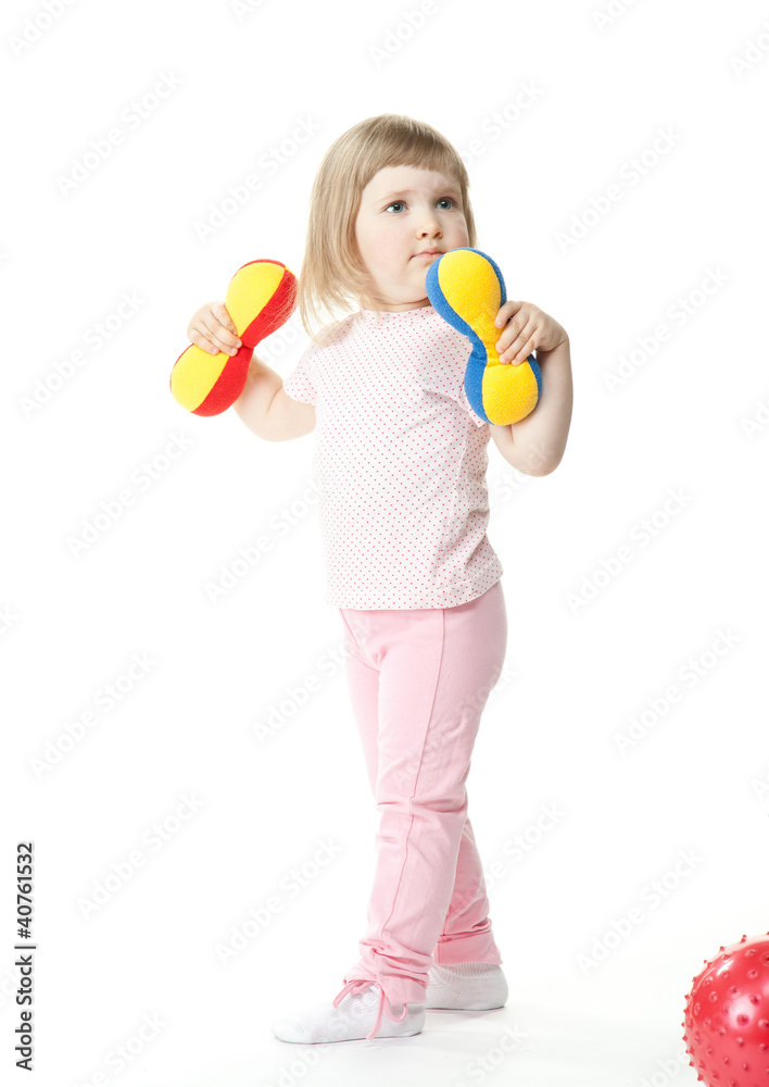 Baby girl doing exercises with toy dumbbells Baby girl doing exercises with toy dumbbells