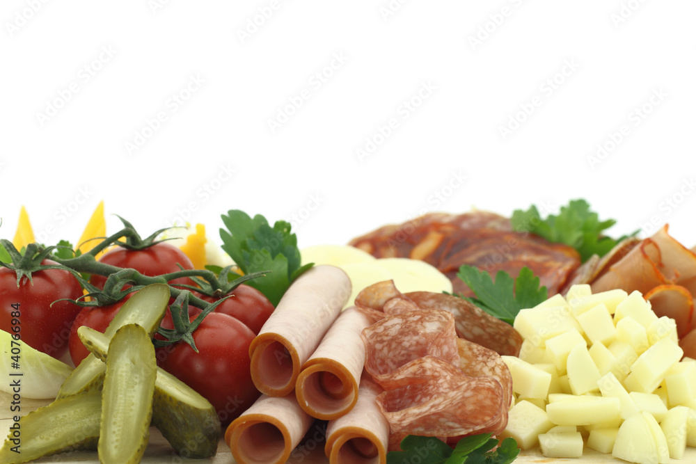 Meat delicatessen plate with cheese