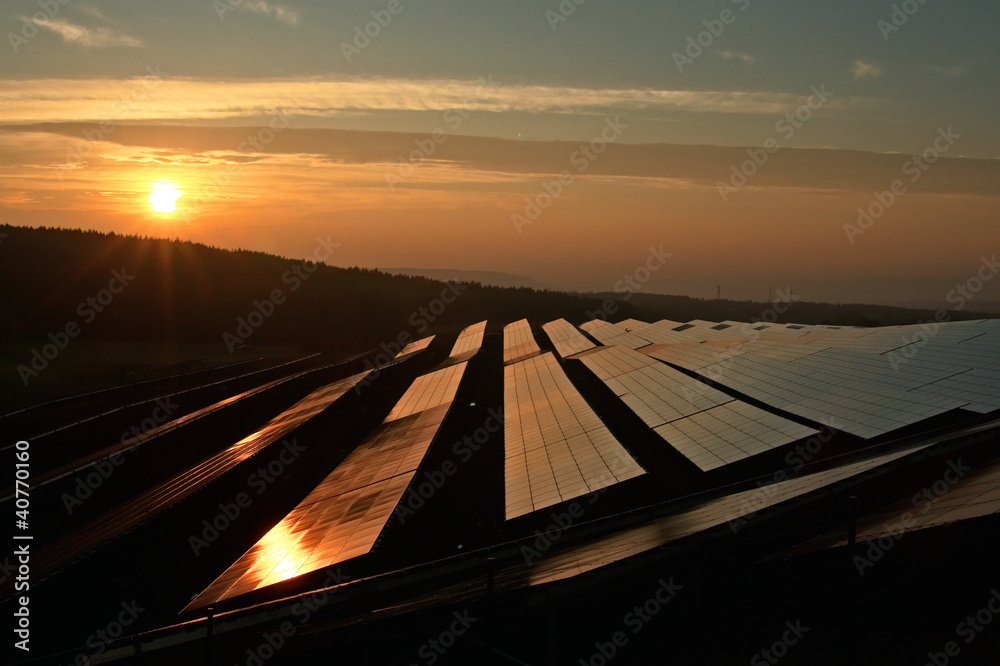Sunset over the solar power plant