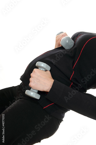 A pregnant woman working out with weights isolated over white
