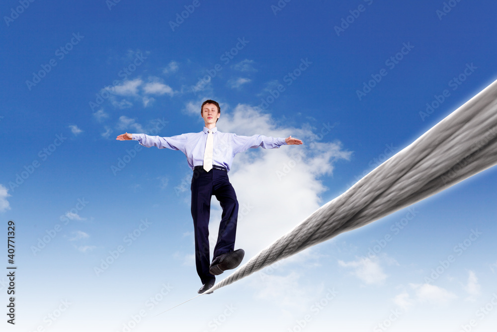 Business man balancing on the rope Business man balancing on the rope