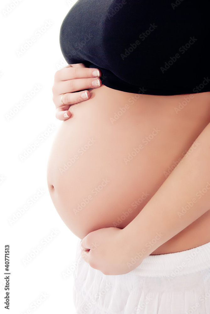 Pregnant woman holding her belly Pregnant woman holding her belly