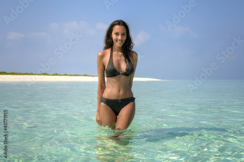 Beautiful sexy girl standing in lagoon (Maldives)