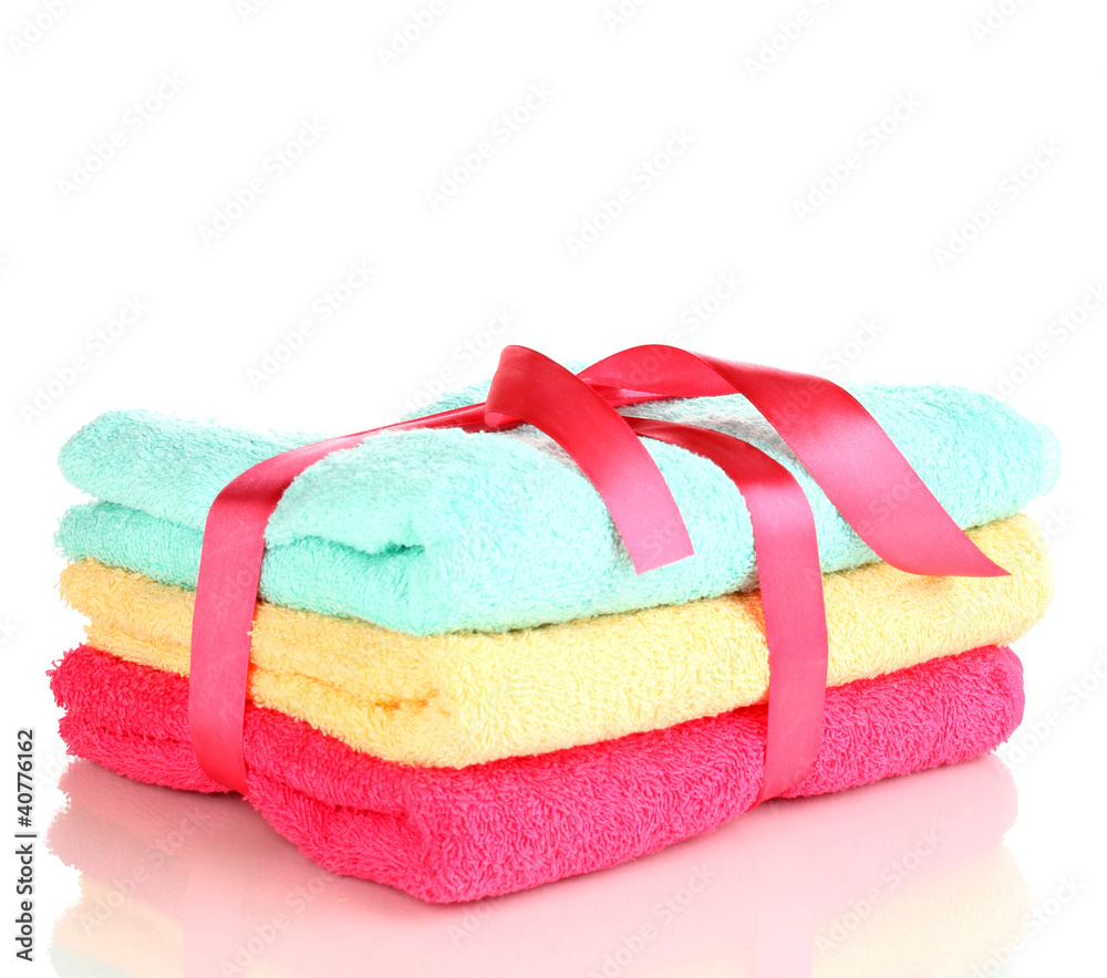 Colorful towels with ribbon isolated on white Colorful towels with ribbon isolated on white
