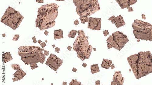 Brownies falling down on white background