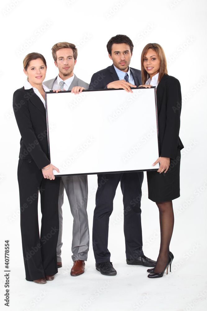 executives holding a framed board left blank for your image executives holding a framed board left blank for your image