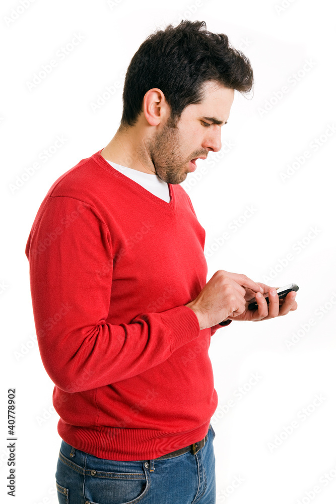 Young casual man reading a sms, isolated on white Young casual man reading a sms, isolated on white