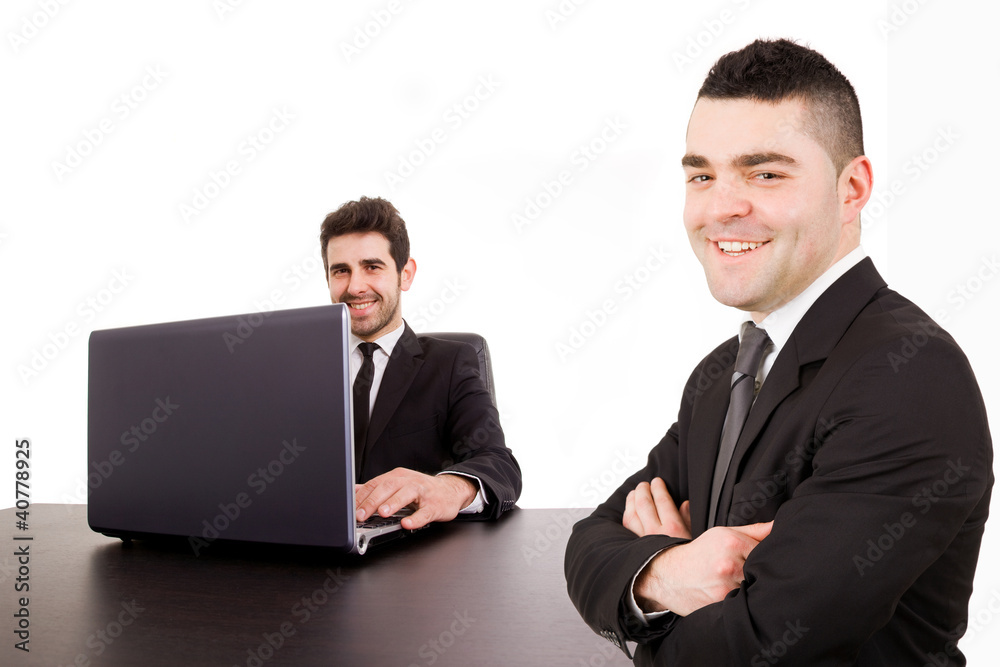 two young businessmen together at the office desk, isolated on w two young businessmen together at the office desk, isolated on w