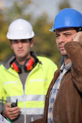 A concerned construction foreman