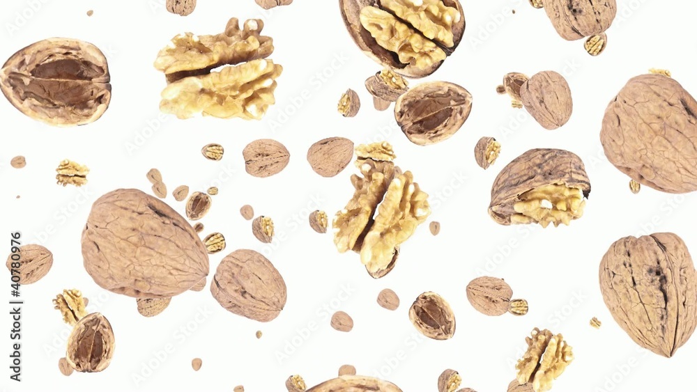 Walnuts falling down on white background