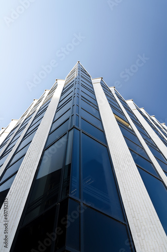 Office building under blue cloudless sky