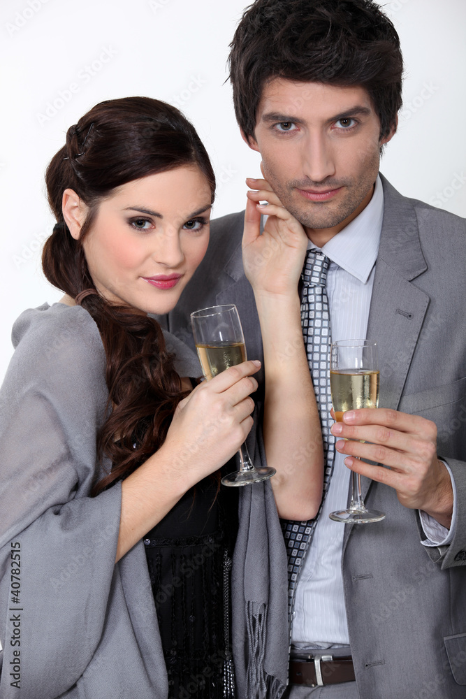A couple drinking champagne.