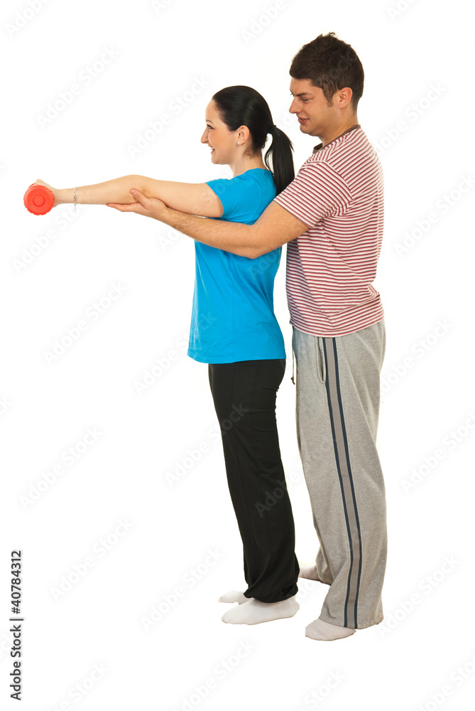 Fototapeta premium Trainer man helping woman
