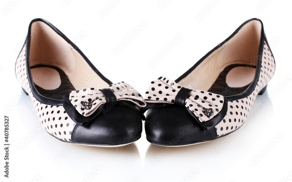 Female flat ballet shoes patterned with black polka dots Female flat ballet shoes patterned with black polka dots