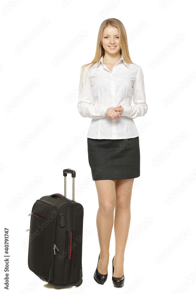 Full length of business woman standing with travel bag Full length of business woman standing with travel bag