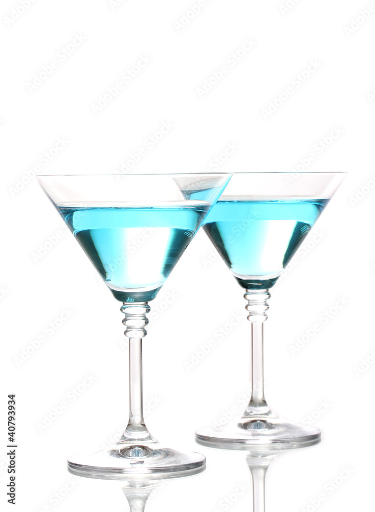 Blue cocktail in martini glasses isolated on white Blue cocktail in martini glasses isolated on white