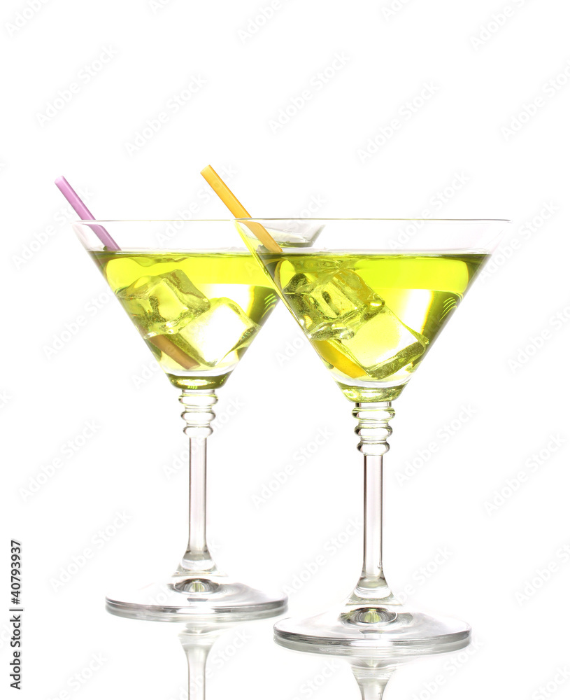 Yellow cocktail in martini glasses isolated on white