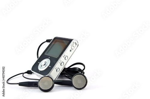 mp3 player and headphones. Portable music player showcase home office electronic device minimalist setting close-up view sound innovation