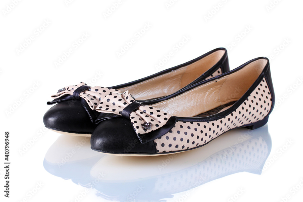 Female flat ballet shoes patterned with black polka dots Female flat ballet shoes patterned with black polka dots