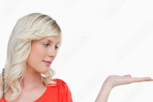 Beautiful woman placing her hand palm up