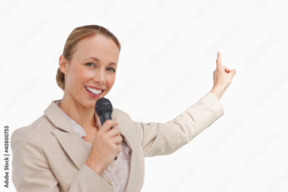 Portrait of a businesswoman in conference with a microphone Portrait of a businesswoman in conference with a microphone