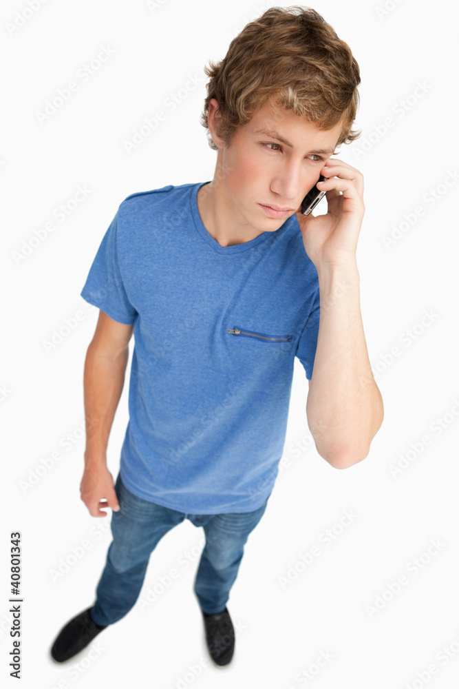 Fisheye view of a young man phoning Fisheye view of a young man phoning