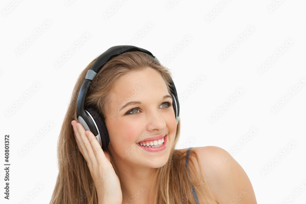 Close-up of a smiling student wearing headphones Close-up of a smiling student wearing headphones