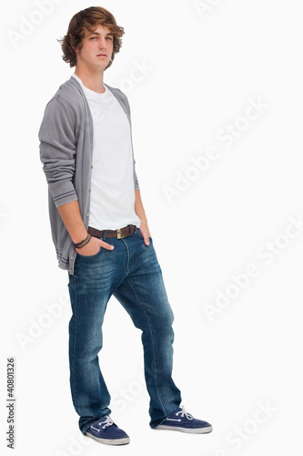 Handsome student posing hands in pockets