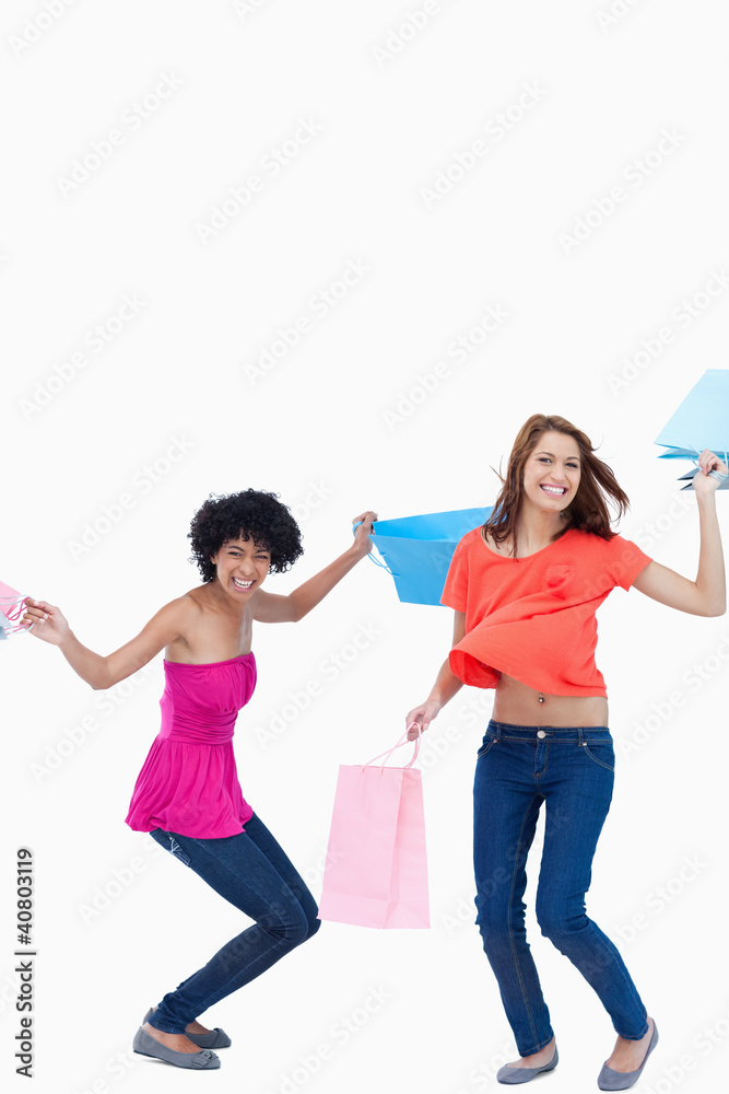 Teenager flexing her legs while her friend is standing up Teenager flexing her legs while her friend is standing up