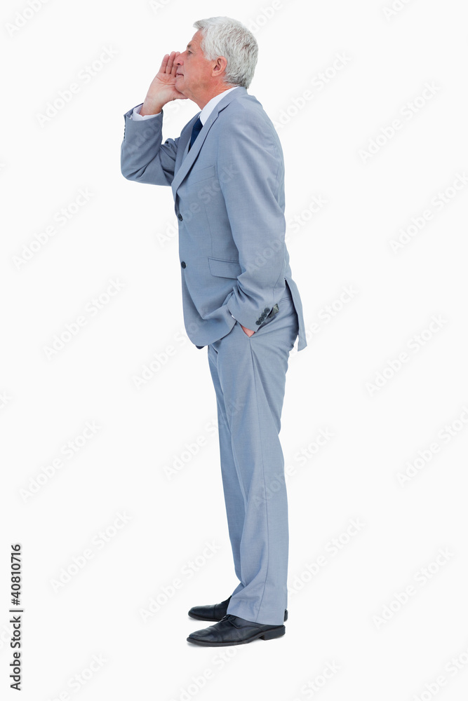 Profile of a businessman calling