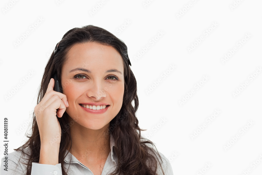 Portrait of a smiling brunette making a call Portrait of a smiling brunette making a call