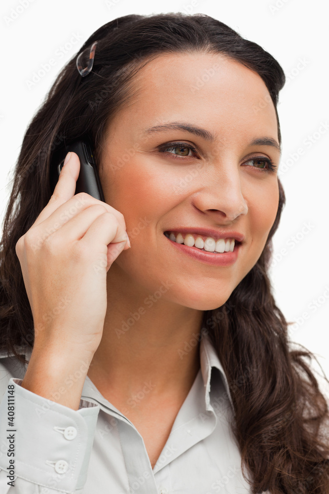 Close-up of a brunette smiling while calling Close-up of a brunette smiling while calling