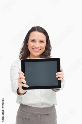 Portrait of a brunette showing a touchpad screen