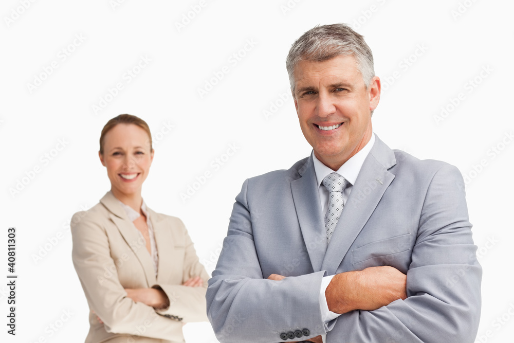Smiling business people with folded arms Smiling business people with folded arms