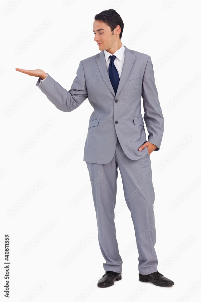 Good-looking man presenting with the hand Good-looking man presenting with the hand