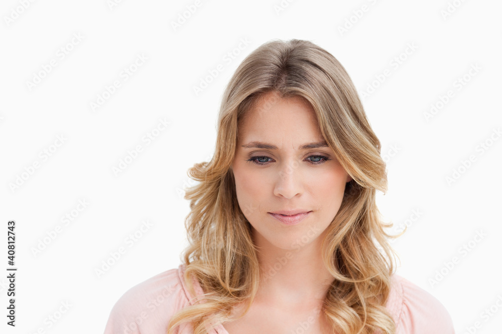Peaceful young woman looking down Peaceful young woman looking down