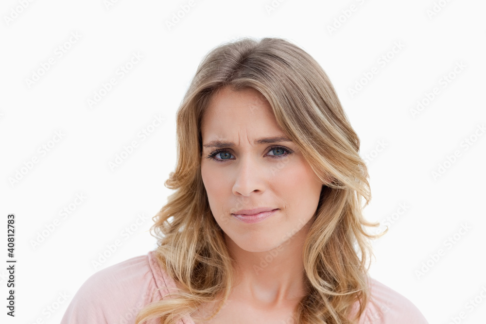 Serious young blonde woman looking at the camera Serious young blonde woman looking at the camera