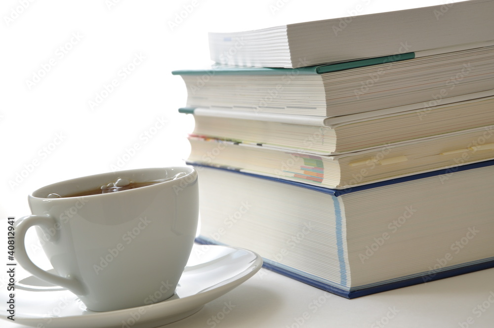 Study scene, coffee and books lit Study scene, coffee and books lit